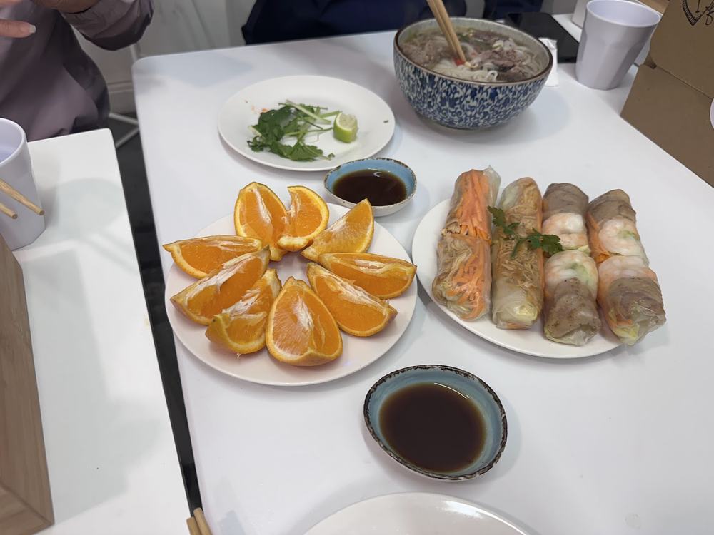 Spring rolls and dishes laid out